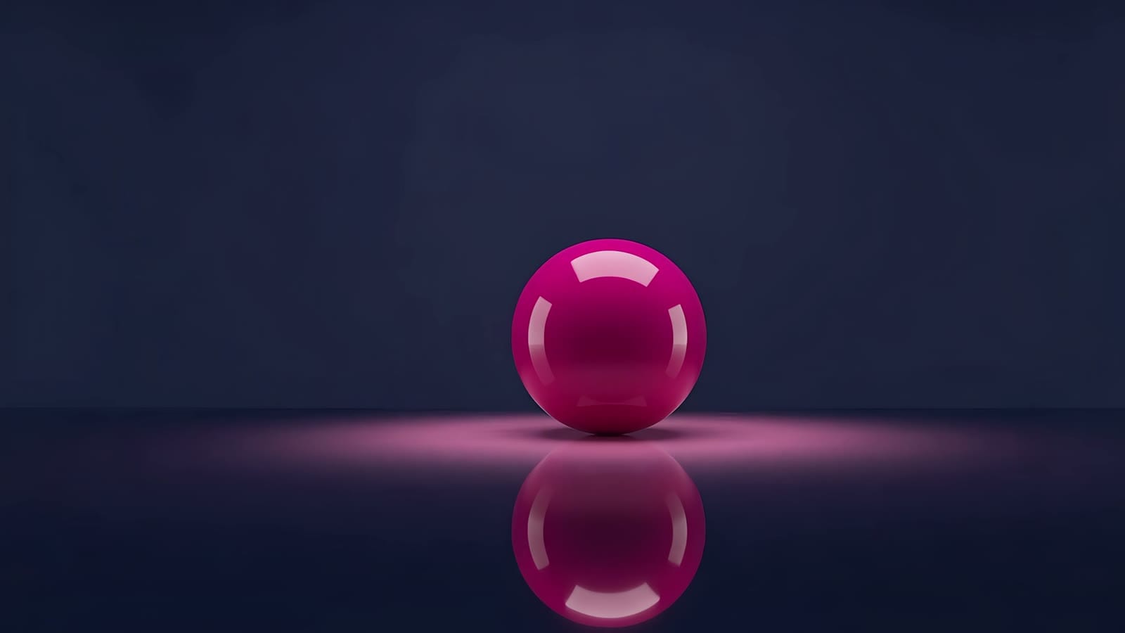 Una esfera magenta brillante sobre un piso de vidrio oscuro